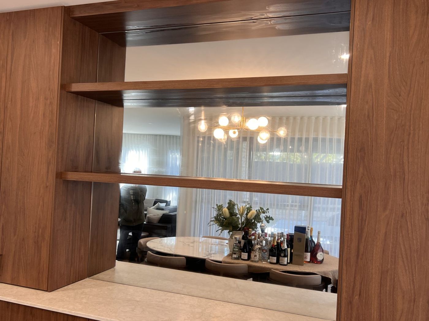 Feature mirror in timber shelving