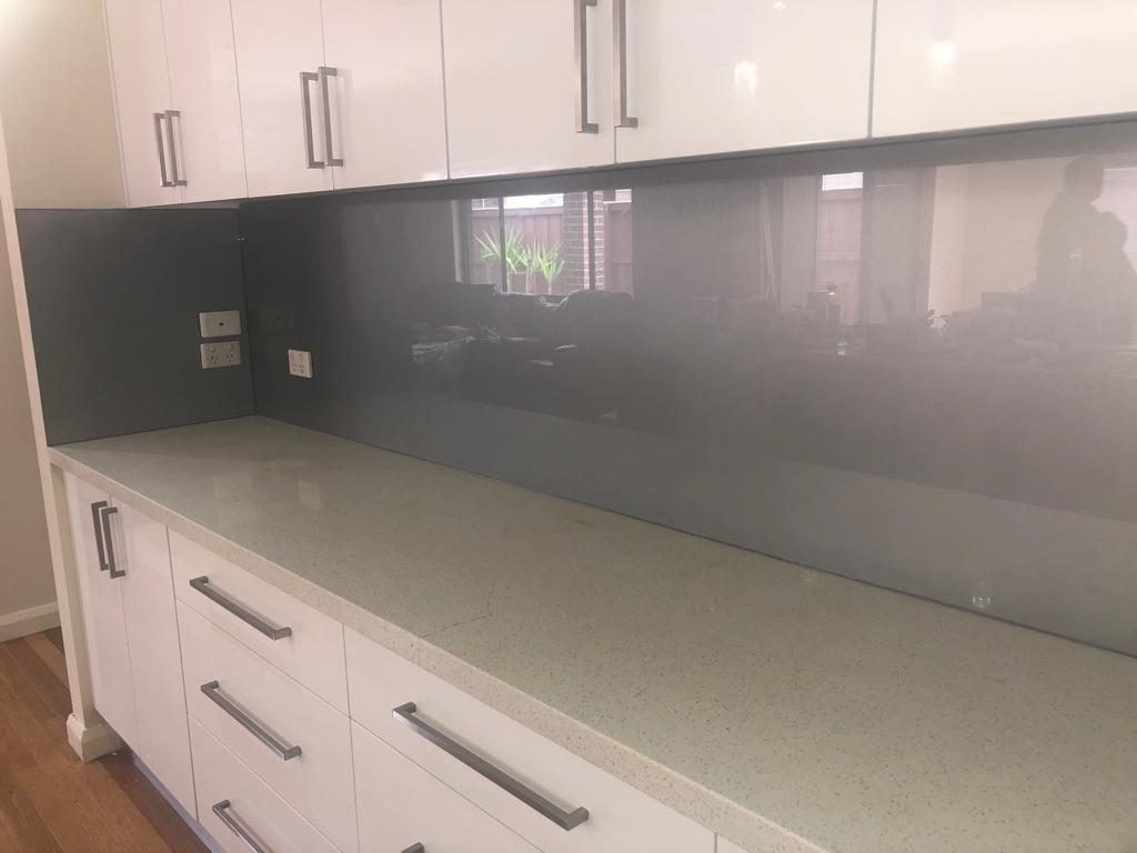 Grey glass kitchen splashback