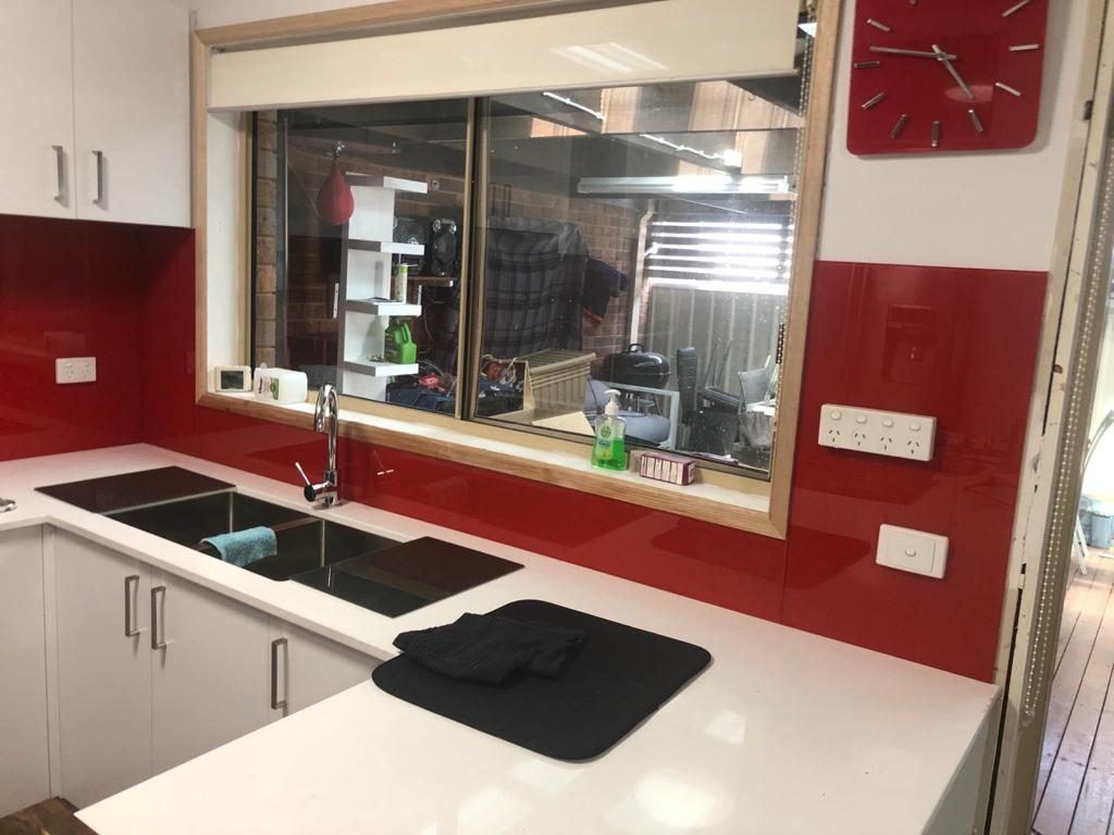 Red glass kitchen splashback